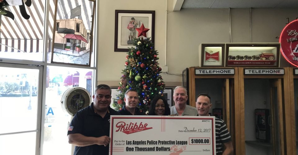 Philippe's Donates $1k to LAPPL's Blue Christmas